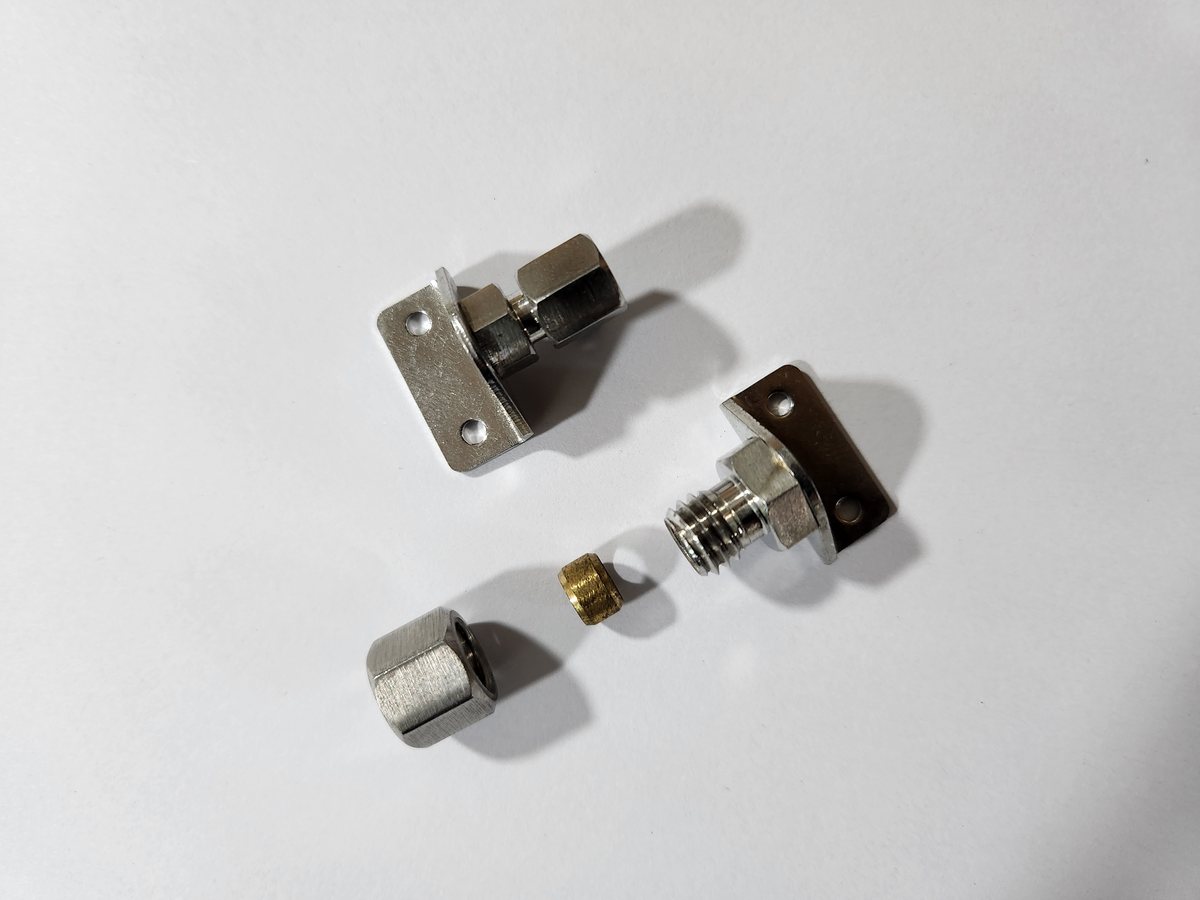 A compression tube adaptor shown as bracket, fitting and ferrule