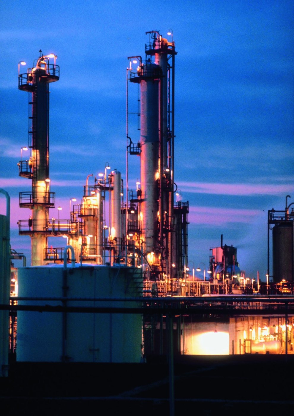 A process plant lit at dusk