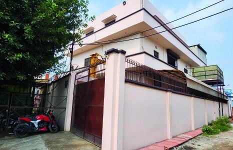 The Apex Thermocon works, a two storey building behind a boundary wall